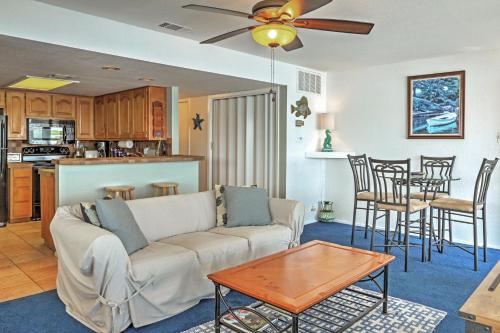 a living room and kitchen with a couch and a table at Spicewood Condo on The South Shore of Lake Travis! in Spicewood