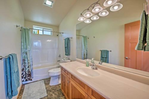 a bathroom with a sink and a toilet and a shower at Sequim Cottage with Panoramic Olympic Mtn Views! in Sequim