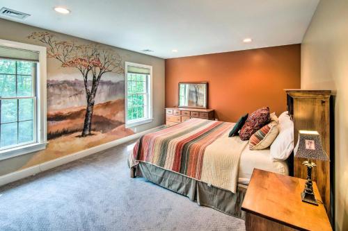 een slaapkamer met een bed en een schilderij aan de muur bij Extravagant Atglen Manor with Private 60-Acre Land! in Atglen