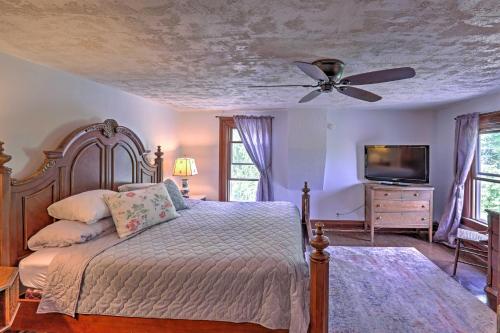 a bedroom with a bed and a ceiling fan at Spacious Finger Lakes Vacation Rental on 6 Acres! in Naples