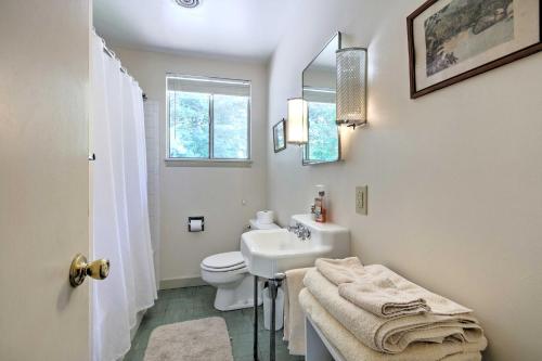 a white bathroom with a sink and a toilet at Stair-Free Lexington Home with Blue Ridge Mtn Views! in Lexington