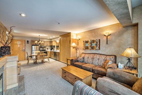 a living room with a couch and a table at Big Sky Condo with Mountain Views, Hike, Ski and Fish! in Big Sky