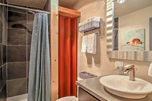 a bathroom with a sink and a shower at Scenic Lead Cabin Steps to Terry Peak Ski Area! in Lead