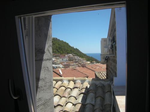 a view of a city from a window at Residence Timeo in Ustica