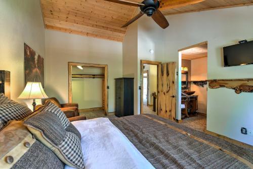 A bed or beds in a room at Wooded Retreat with Deck 4 Mi to Downtown Flagstaff