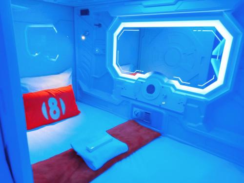 Una cama o camas en una habitación de 8Hostel