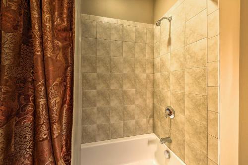 a bathroom with a shower and a bath tub at Southwind Seven Springs Home on Ski Slopes! in Champion