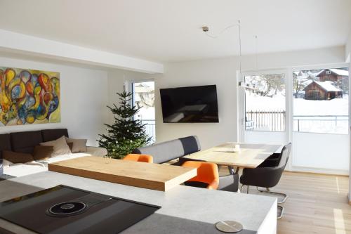 a living room with a couch and a table at Ferienhaus Lurger in Strassen