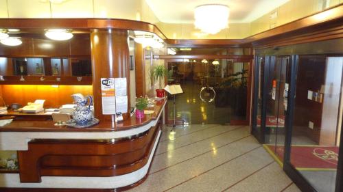 a lobby with a bar in a building at Le Gronde in Cava Manara
