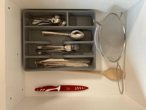 a drawer full of utensils in a refrigerator at Apartman Nikola Trojanovice in Trojanovice