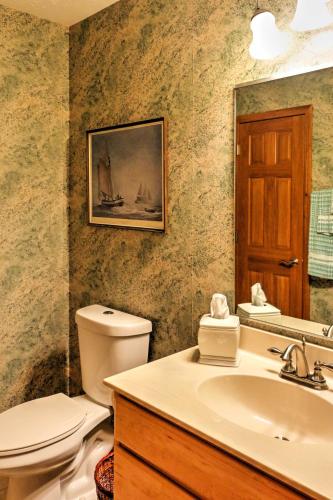 a bathroom with a toilet and a sink at Roomy House on 2 Acres - 2 Mi to Egg Harbor Beach! in Egg Harbor