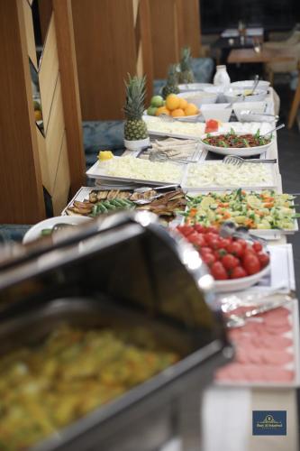 a buffet line with many different plates of food at Burj Al Istanbul in Istanbul