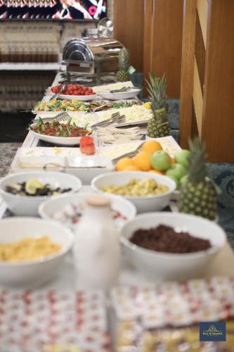 a buffet line with plates of food on a table at Burj Al Istanbul in Istanbul