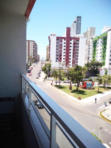 a view from a balcony of a city street at Hotel Ficare Torres in Torres