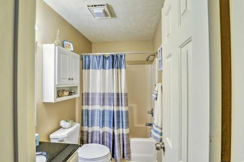 a bathroom with a blue and white shower curtain at Myrtle Beach Oasis on River Oaks Golf Course! in Myrtle Beach