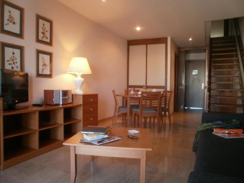 a living room with a table and a dining room at Residence Garden in Rome