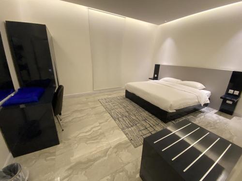Ліжко або ліжка в номері Sadan Furnished Apartments
