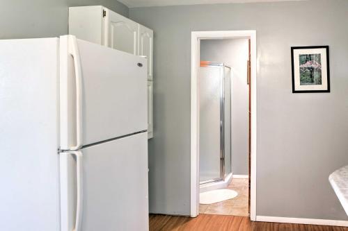 a white refrigerator in a room with a doorway at Mayfield Home with Private Dock on Lake Sacandaga! in Broadalbin
