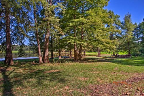 a park with trees and a body of water at Cozy Studio Cabin on Lake O the Pines with Deck! in Avinger