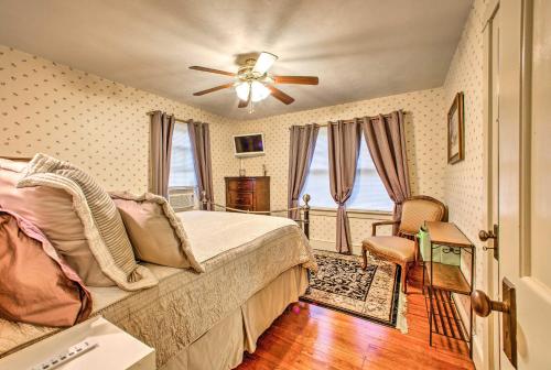 a bedroom with a bed and a ceiling fan at Whimsical Lancaster Home - 4 Mi to Sight and Sound in Lancaster