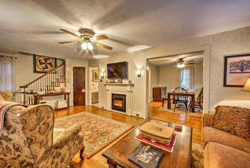 a living room with a couch and a fireplace at Whimsical Lancaster Home - 4 Mi to Sight and Sound in Lancaster