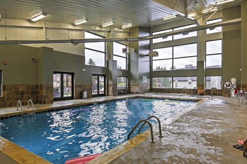 a large indoor swimming pool in a building at Condo on Fraser River Less Than 4 Mi to Winter Park Resort in Winter Park