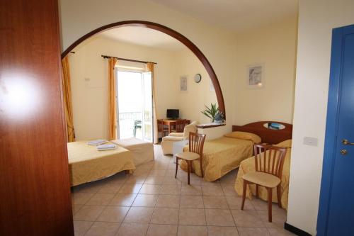 a room with two beds and a living room at Viviani Raffaella in Monterosso al Mare
