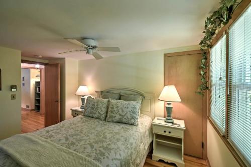 a bedroom with a bed with two night stands and two lamps at The Carriage House Walk to Peninsula State Park in Ephraim