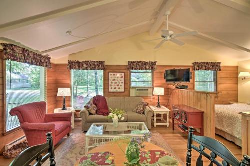 a living room with a couch and a table at Cozy Cottage Duplex Walk to Peninsula State Park! in Ephraim