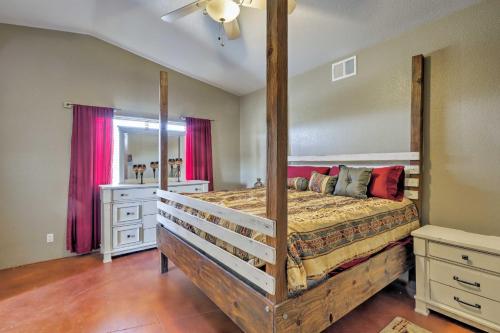 a bedroom with a large bed and a mirror at Lake Havasu Getaway with Patio - Hike, Swim, and Golf! in Lake Havasu City