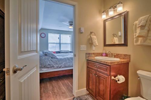 a bathroom with a sink and a bedroom at Gunnison Studio with Shuttle 30 Mi to Crested Butte in Gunnison