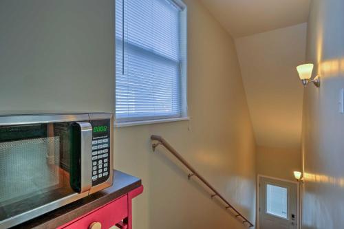 a kitchen with a microwave on top of a counter at Gunnison Studio with Shuttle 30 Mi to Crested Butte in Gunnison
