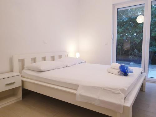 Posteľ alebo postele v izbe v ubytovaní Apartments Ellie