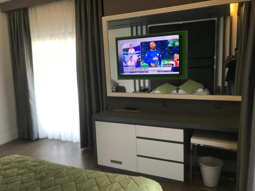 Oyster Boutique Hotelにあるテレビまたはエンターテインメントセンター