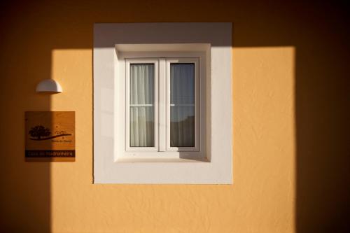 a window on the side of a building at Monte do Giestal - Casas de Campo & Spa in Abela