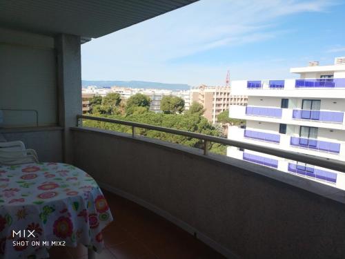 a balcony with a bed and a view of a building at Marathon in Salou