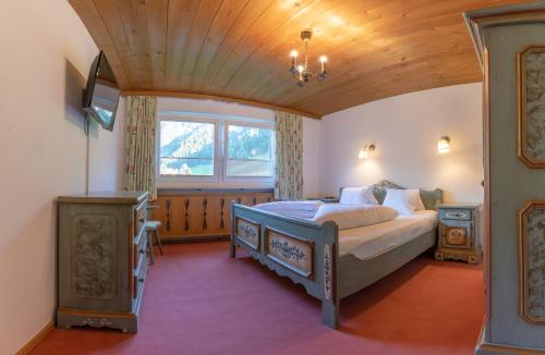 Ένα ή περισσότερα κρεβάτια σε δωμάτιο στο Ahorn Chalet