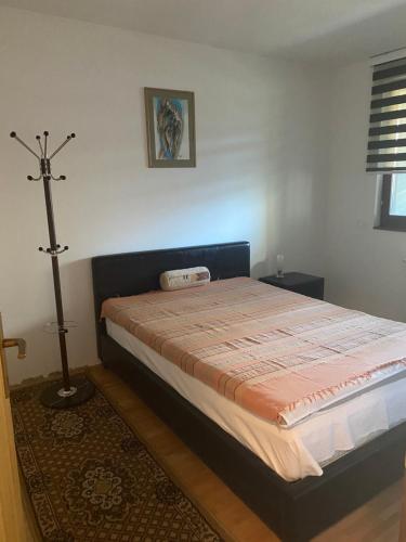 a bedroom with a bed in a room at Apartman 3S Pale Jahorina in Pale