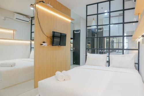 Ένα ή περισσότερα κρεβάτια σε δωμάτιο στο Spacious and Modern Studio Apartment at Atlanta Residences By Travelio