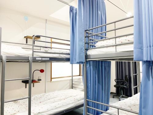 a bedroom with bunk beds in a hostel at Akasakano-sato(Premium) in Tokyo