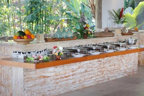 a kitchen with a counter with a stove and fruits at The Bejalin Eco Retreat in Plaga