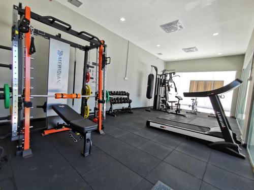 a fitness room with a gym with a treadmill at Hotel Langkasuka Langkawi in Kuah