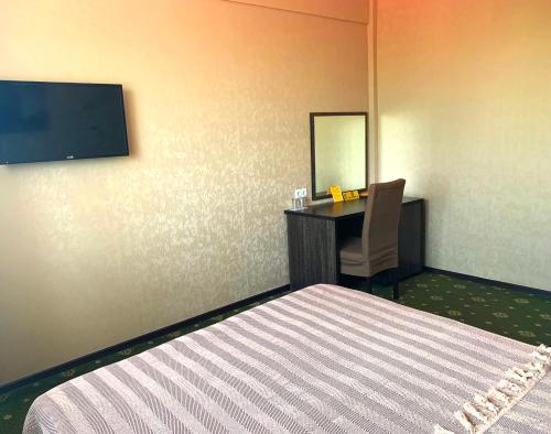 Voodi või voodid majutusasutuse Golden Palace Hotel toas