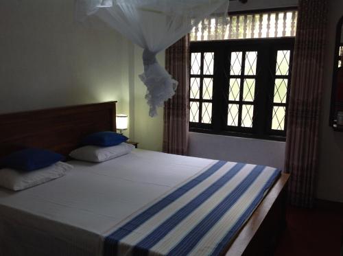Ein Bett oder Betten in einem Zimmer der Unterkunft Saman Homestay