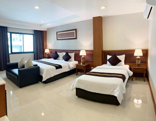 Cama o camas de una habitación en True Siam Rangnam Hotel