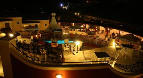 an aerial view of a patio at night at Mediterranean Blue in Kavos