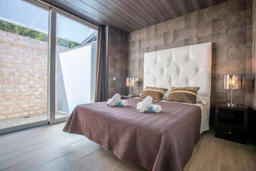Posteľ alebo postele v izbe v ubytovaní Hotel Copacabana Tarifa Beach