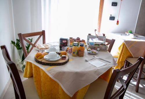 a table with food and drinks on top of it at River Hotel in Castel di Sangro