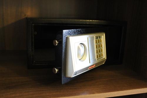 a microwave oven with its door open on a table at Tlou Safari Lodge in Kasane