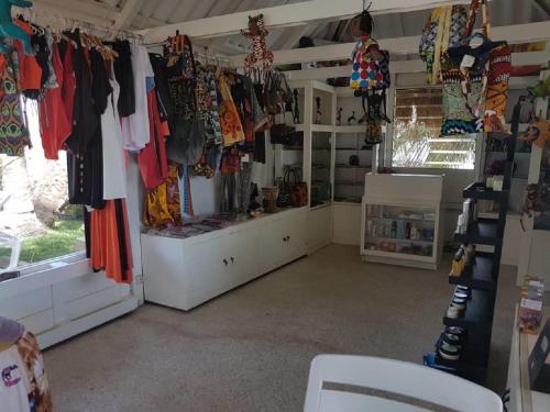 a room with a lot of clothes hanging up at Hotel Jardin Savana Dakar in Dakar